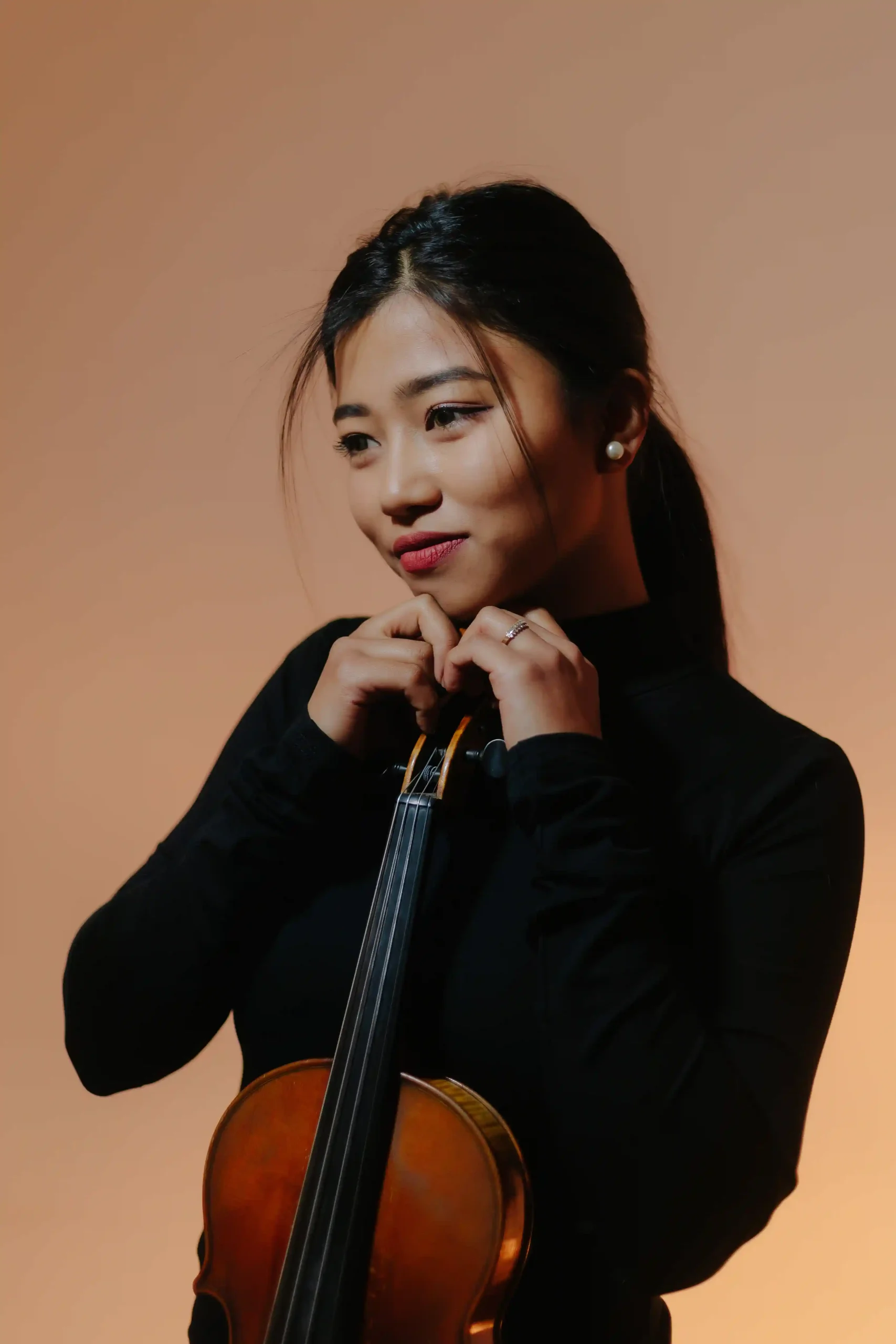 Phoebe with violin in thoughtful moment